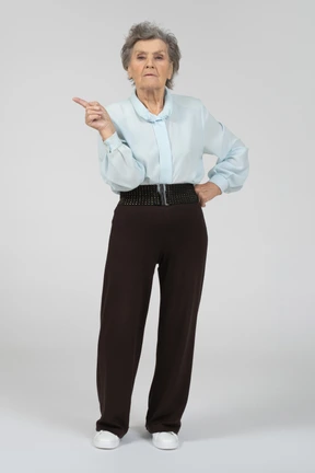Old lady pointing aside