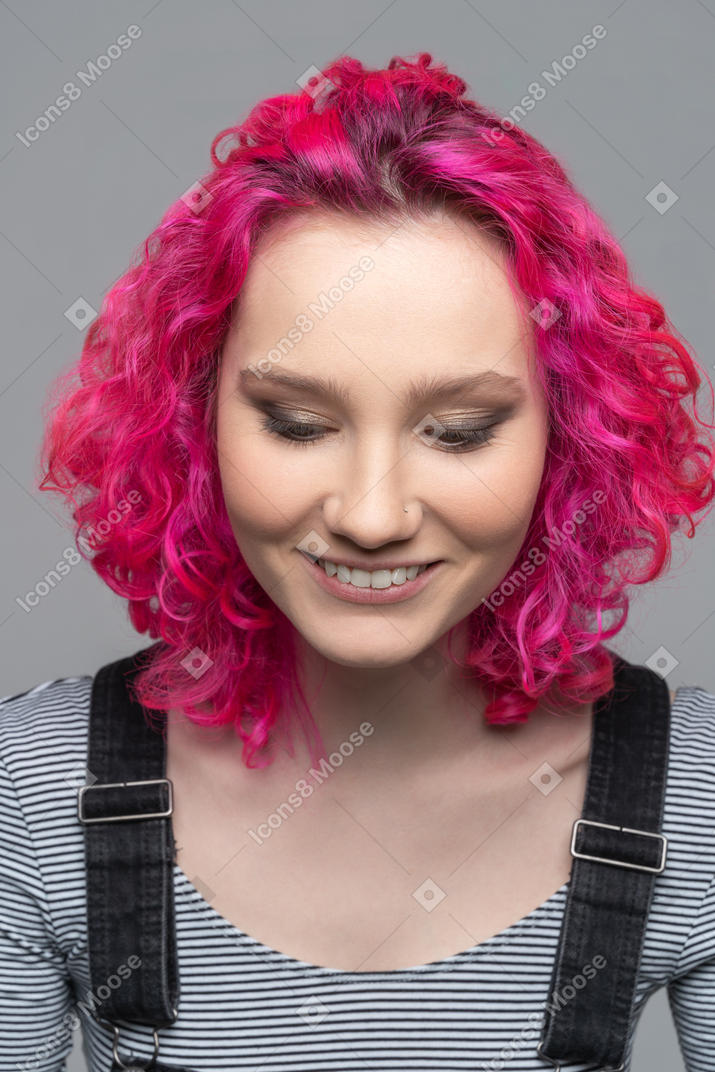 Pleased smiling caucasian girl isolated over gray background