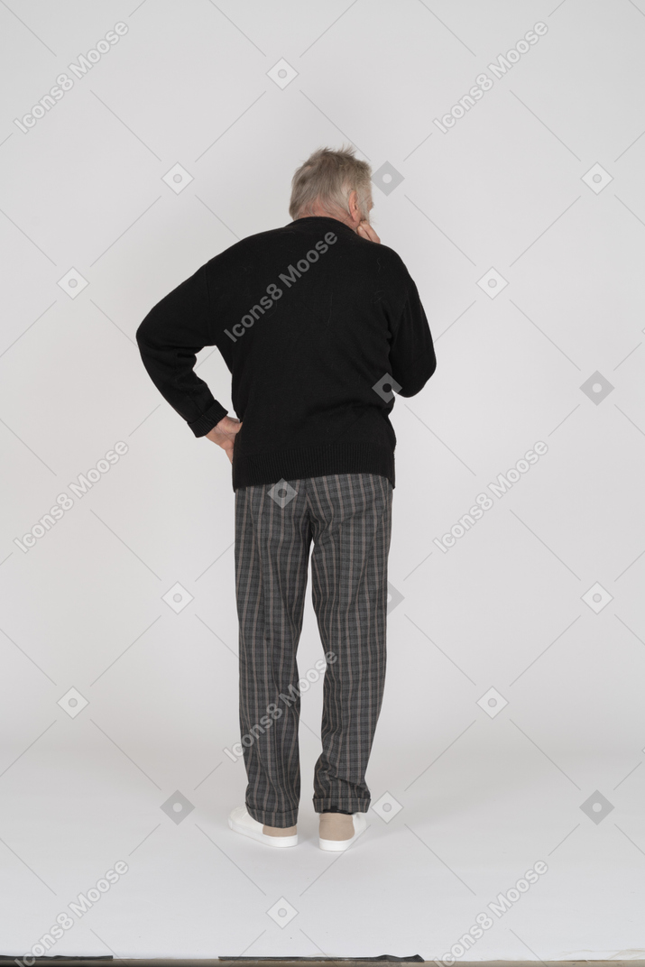 Old man standing akimbo