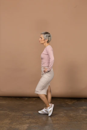 Woman in casual clothes posing in profile