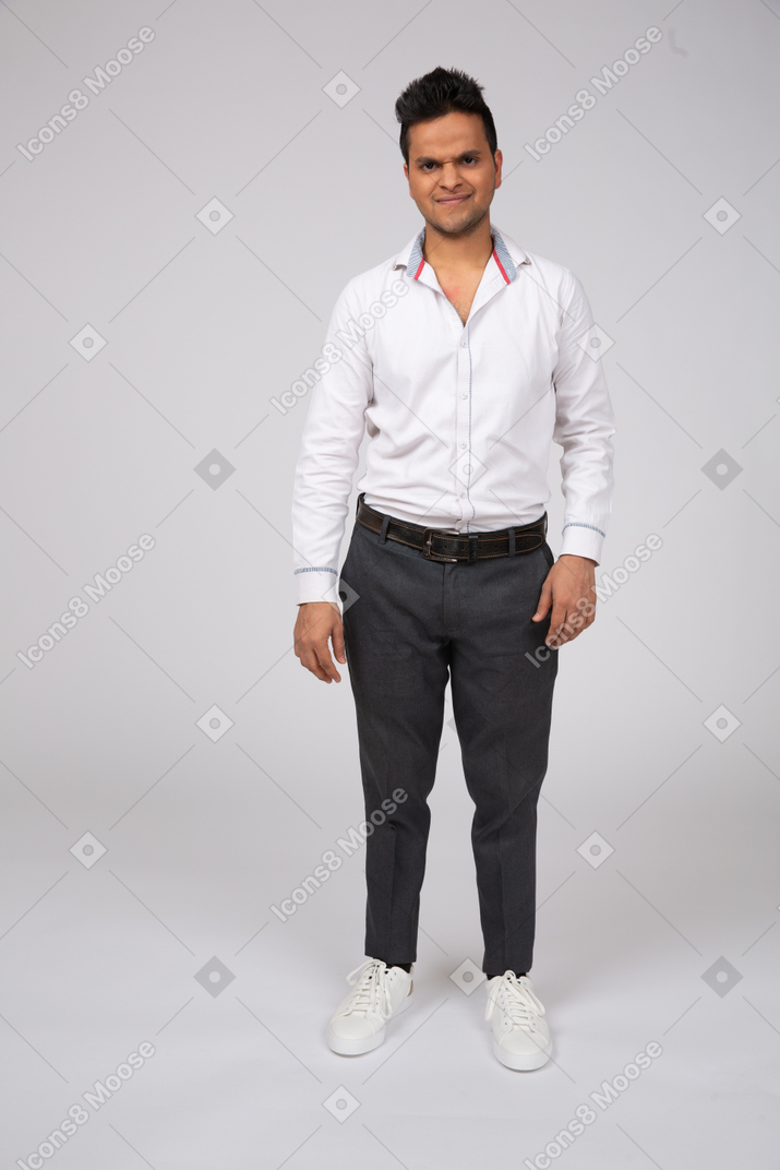 A man in office clothes with a strange look