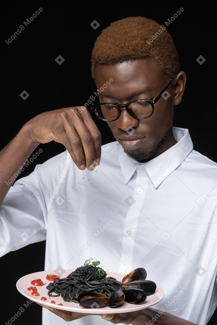 Close-up chef decorating his dish