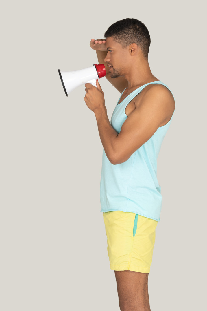 Man holding a megaphone isolated on white background
