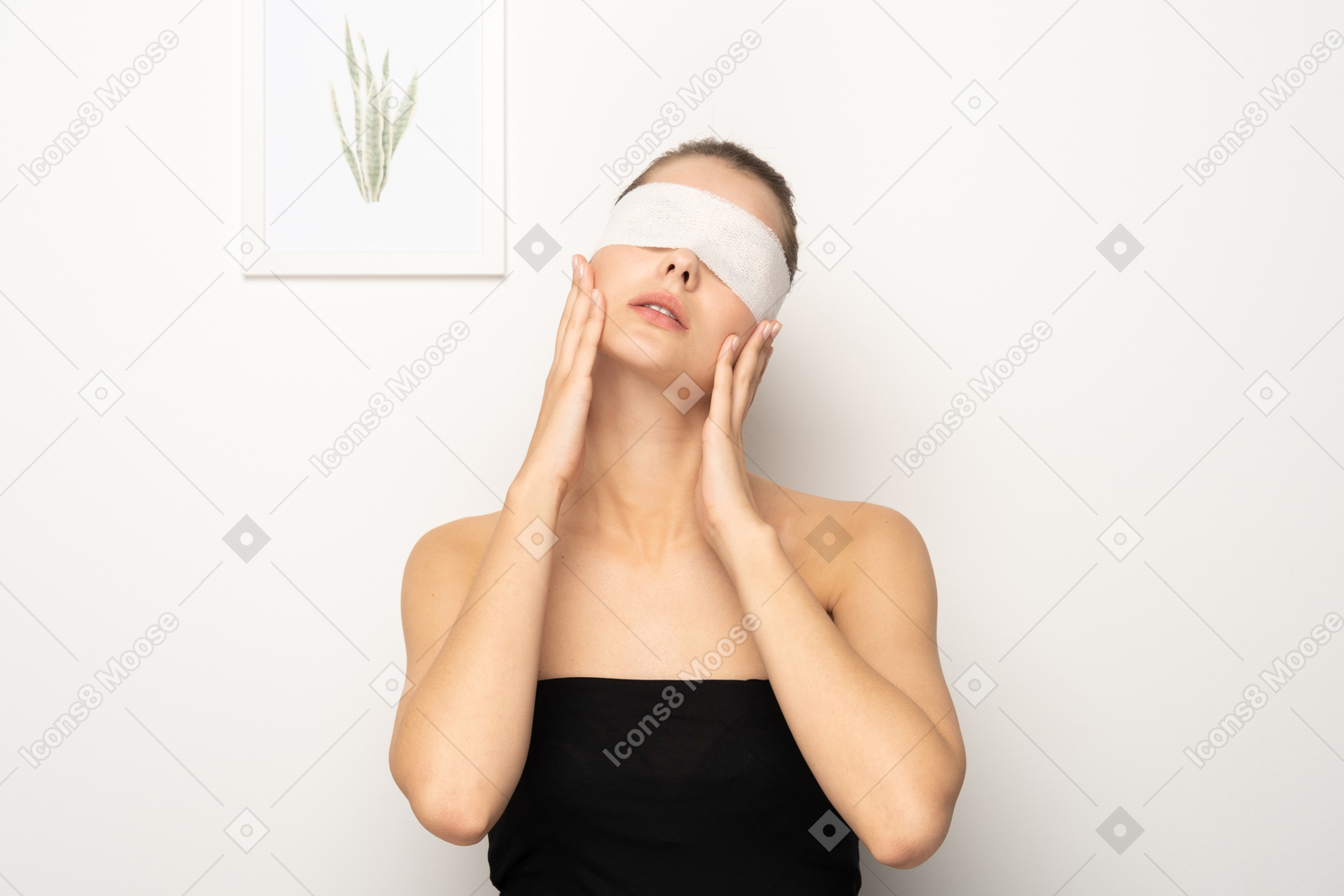 Woman with eye bandage holding her face