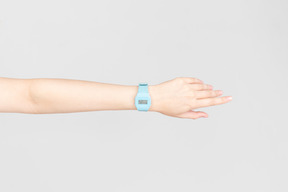 Blue hand watch on female hand