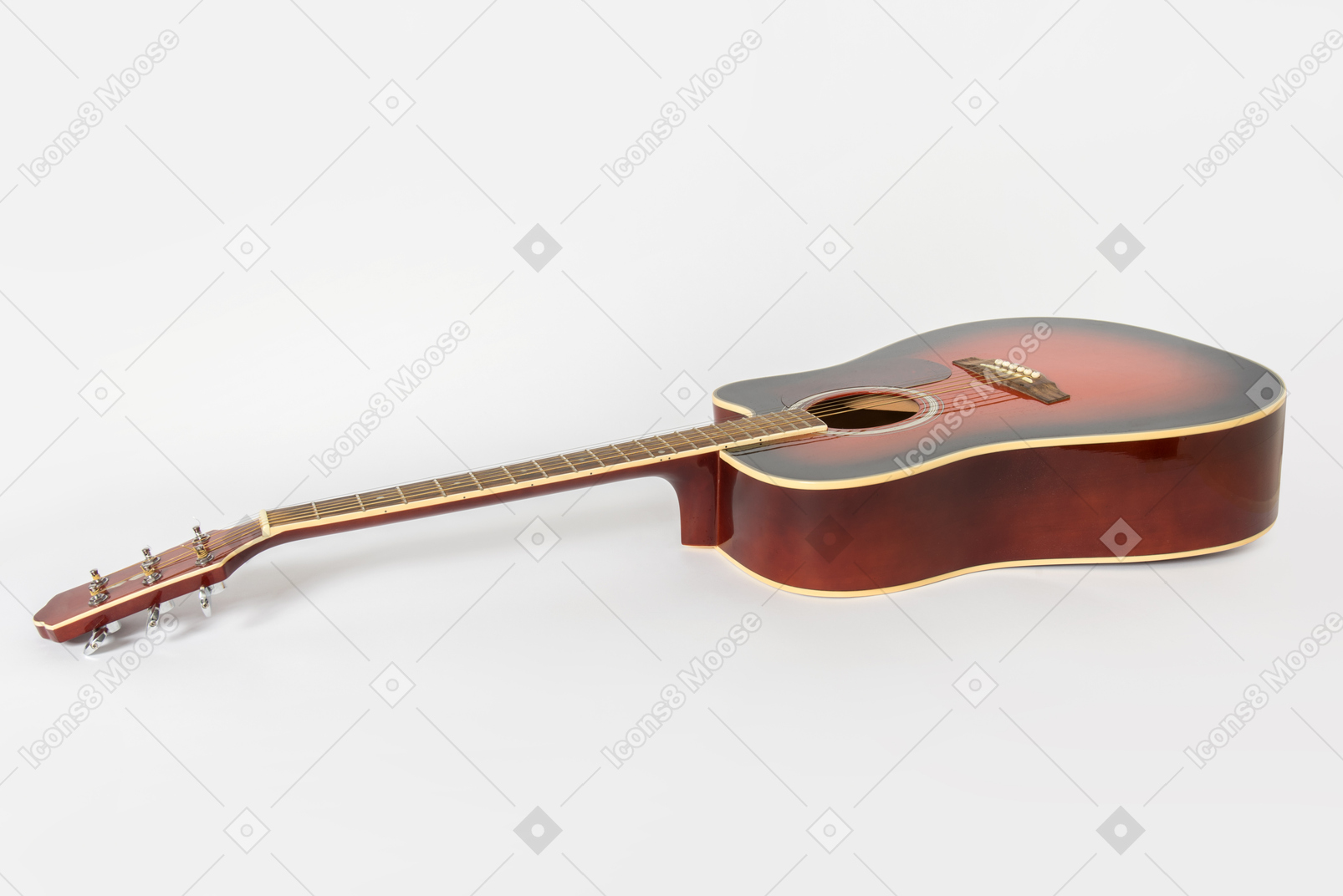 Guitar lying on white background
