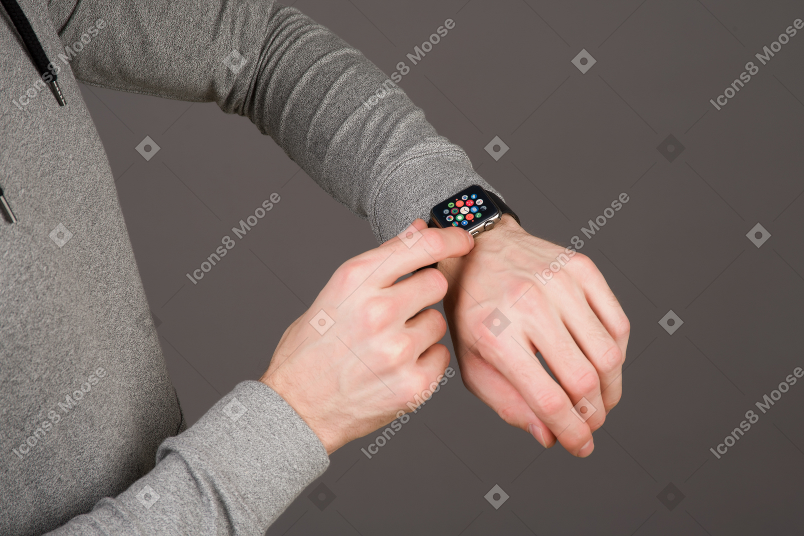 Checking his smartwatch