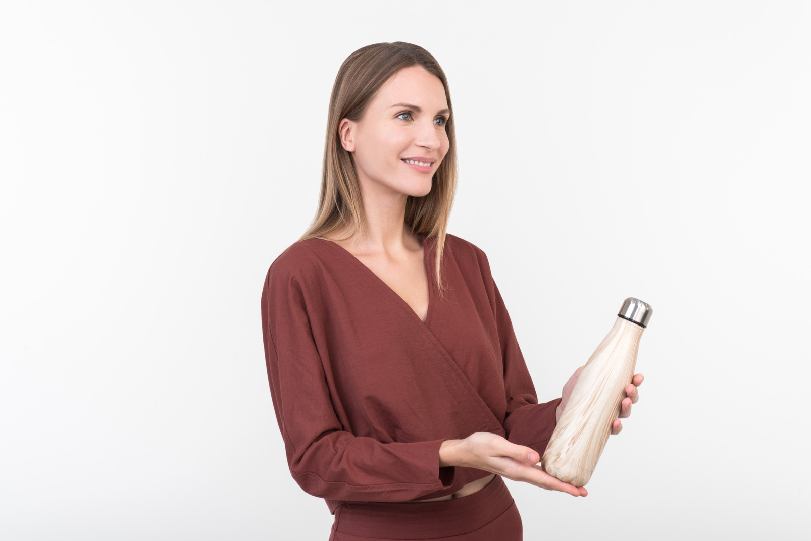 Young woman with a wooden water bottle