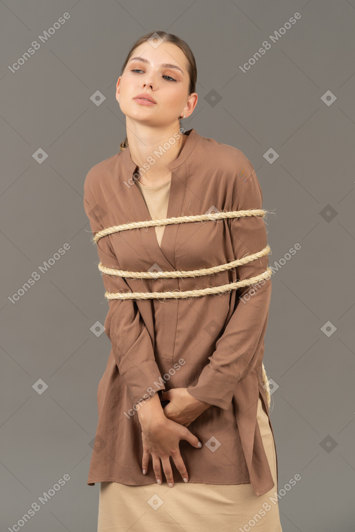Tied up woman standing still