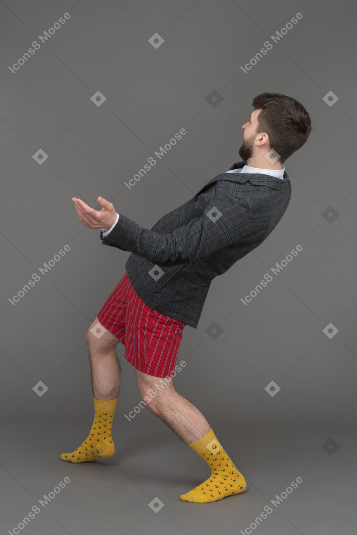 Expressive businessman spreading arms wide apart