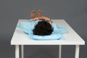 Child lying on the table
