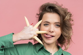 Touching baby corn with a tongue