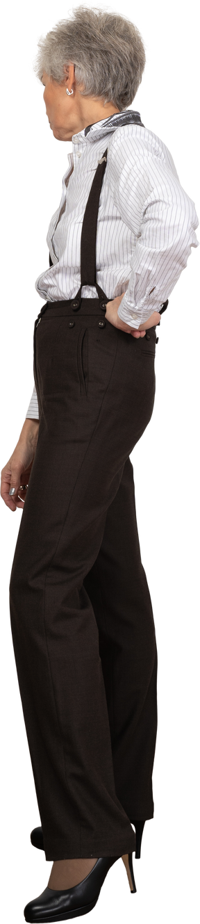 Side view of a curious old lady in office clothing looking aside