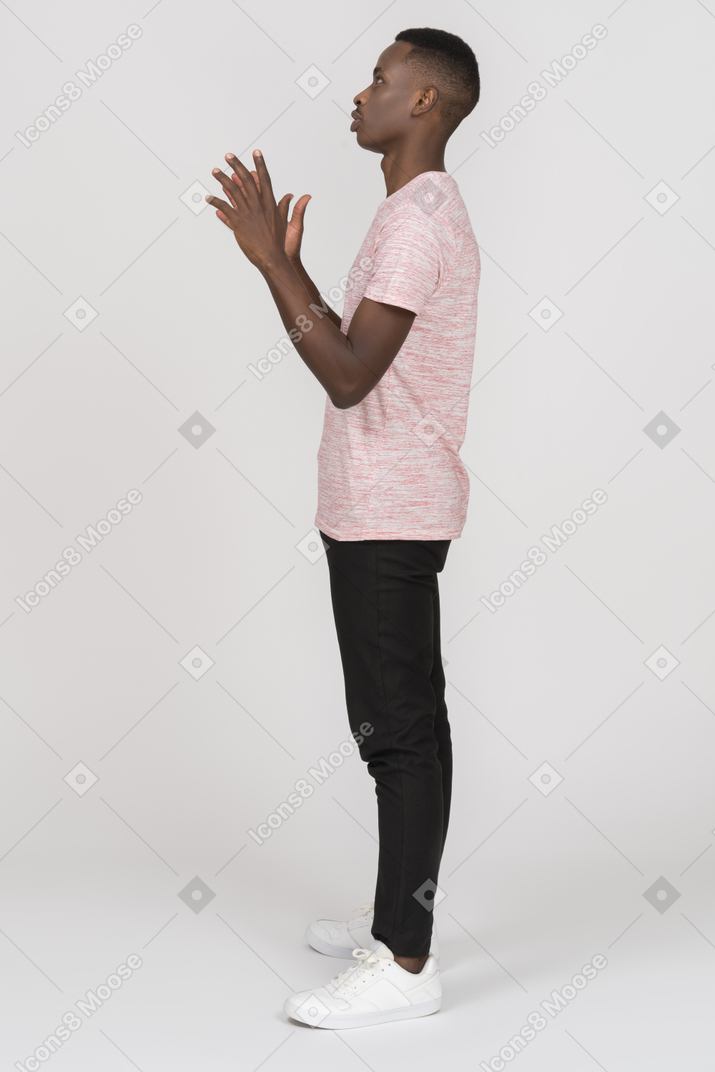 Man standing with raised hands