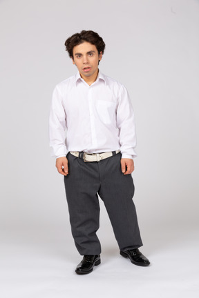 Front view of a shocked man in business casual clothes