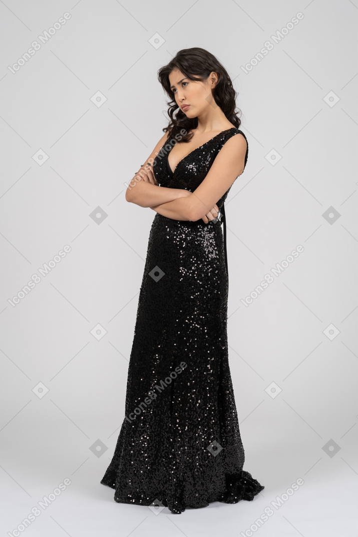 Displeased woman in black evening dress