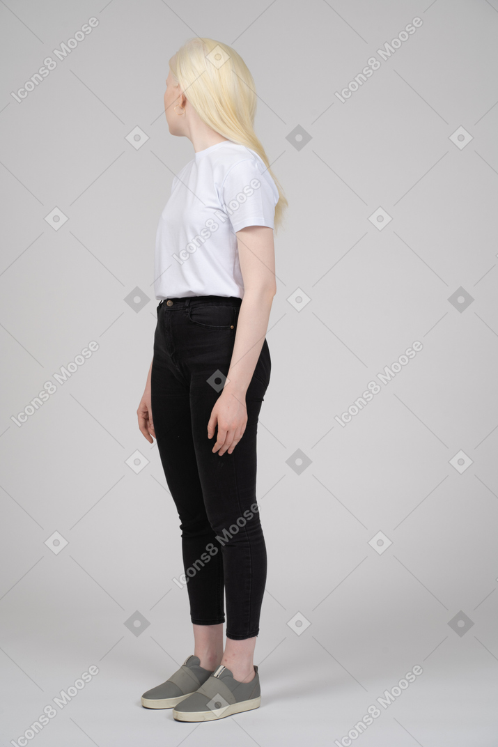 Teenage girl in casual clothes turning away