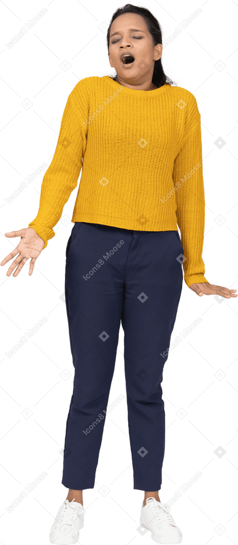 Front view of a sleepy girl in casual clothes standing with outstretched arms and yawning