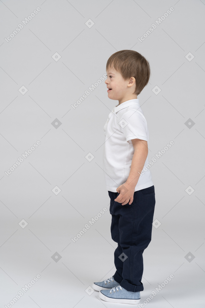 Side view of joyful little boy