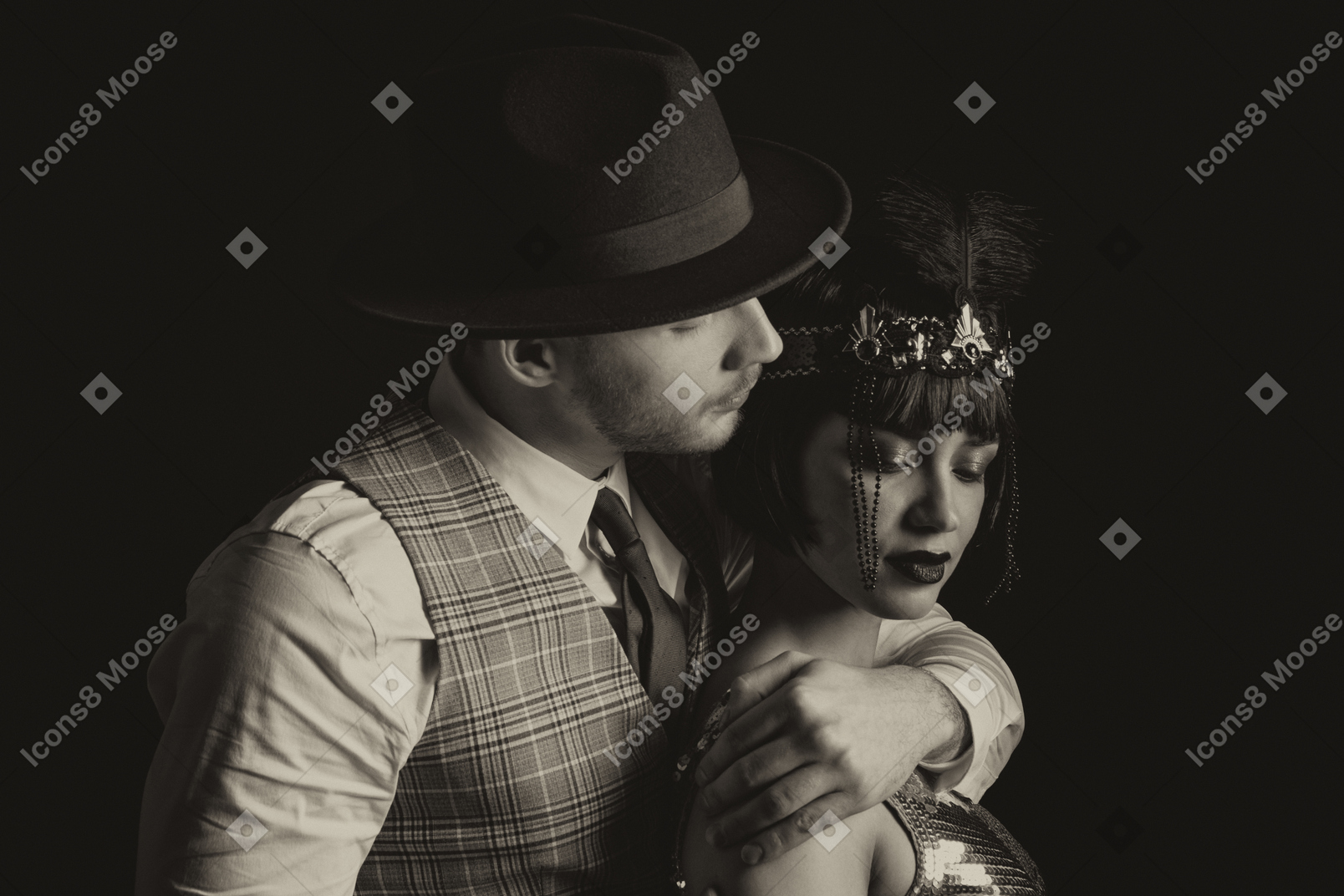 Man in hat holding a beautiful flapper from behind