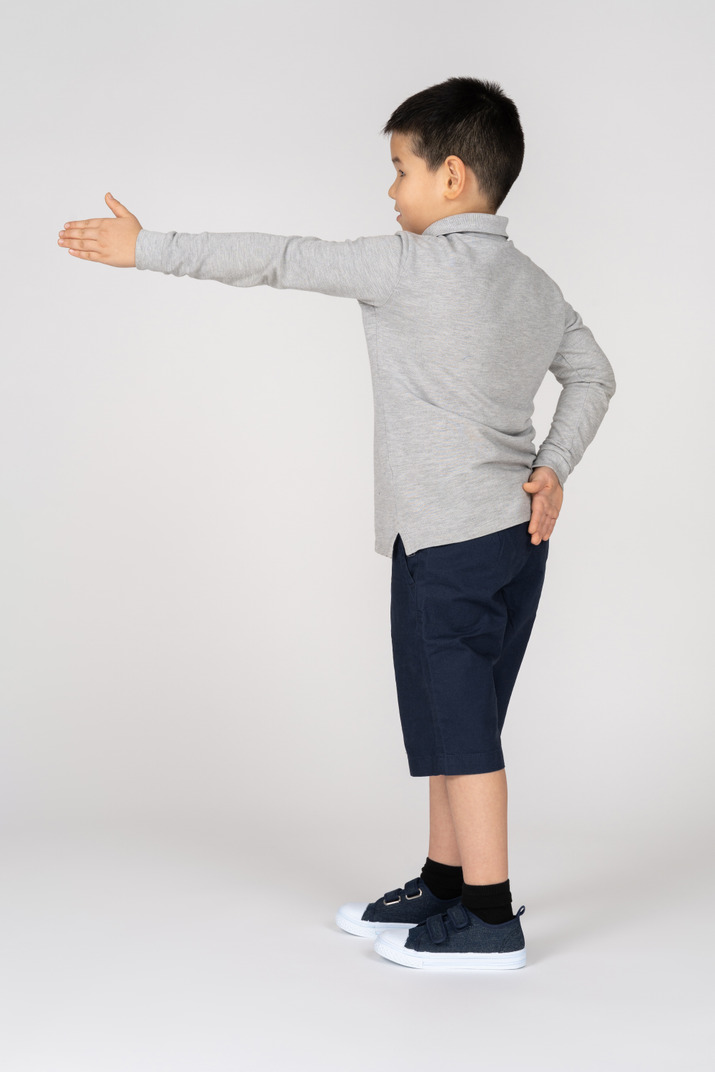 Boy showing direction