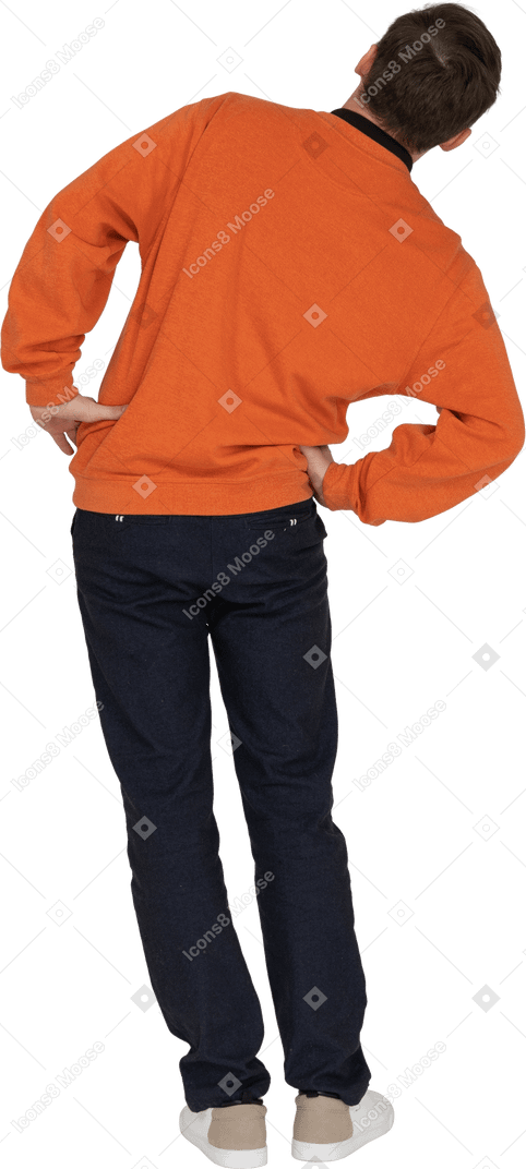 Young man in orange sweatshirt posing