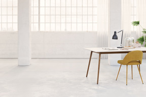 Loft interior with large windows, work desk and chair