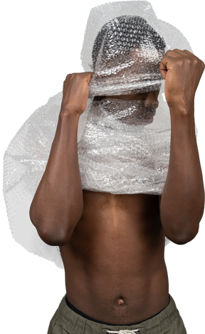 Young african male hiding his face with a plastic wrap