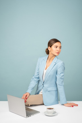 Attractive young worker looking aside