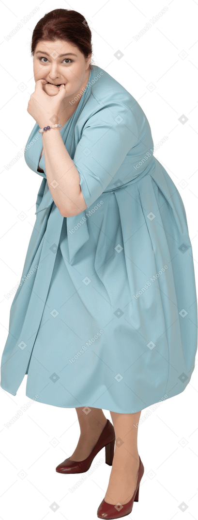 Front view of a woman in blue dress whistling