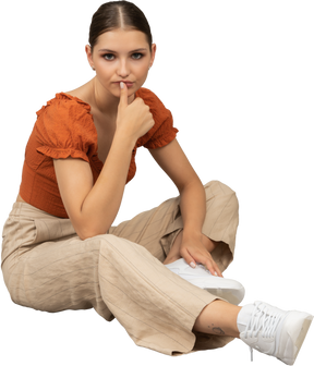 Young woman sits while thinking