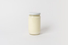 Glass jar with some white sauce