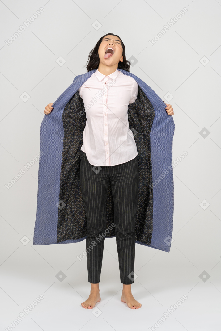 Screaming woman holding coat wide open