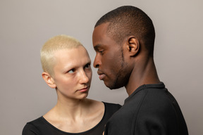 Young woman stares into man's eyes
