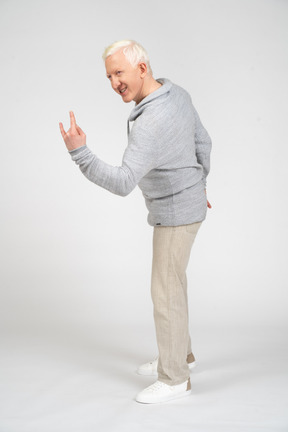 Man showing rock gesture