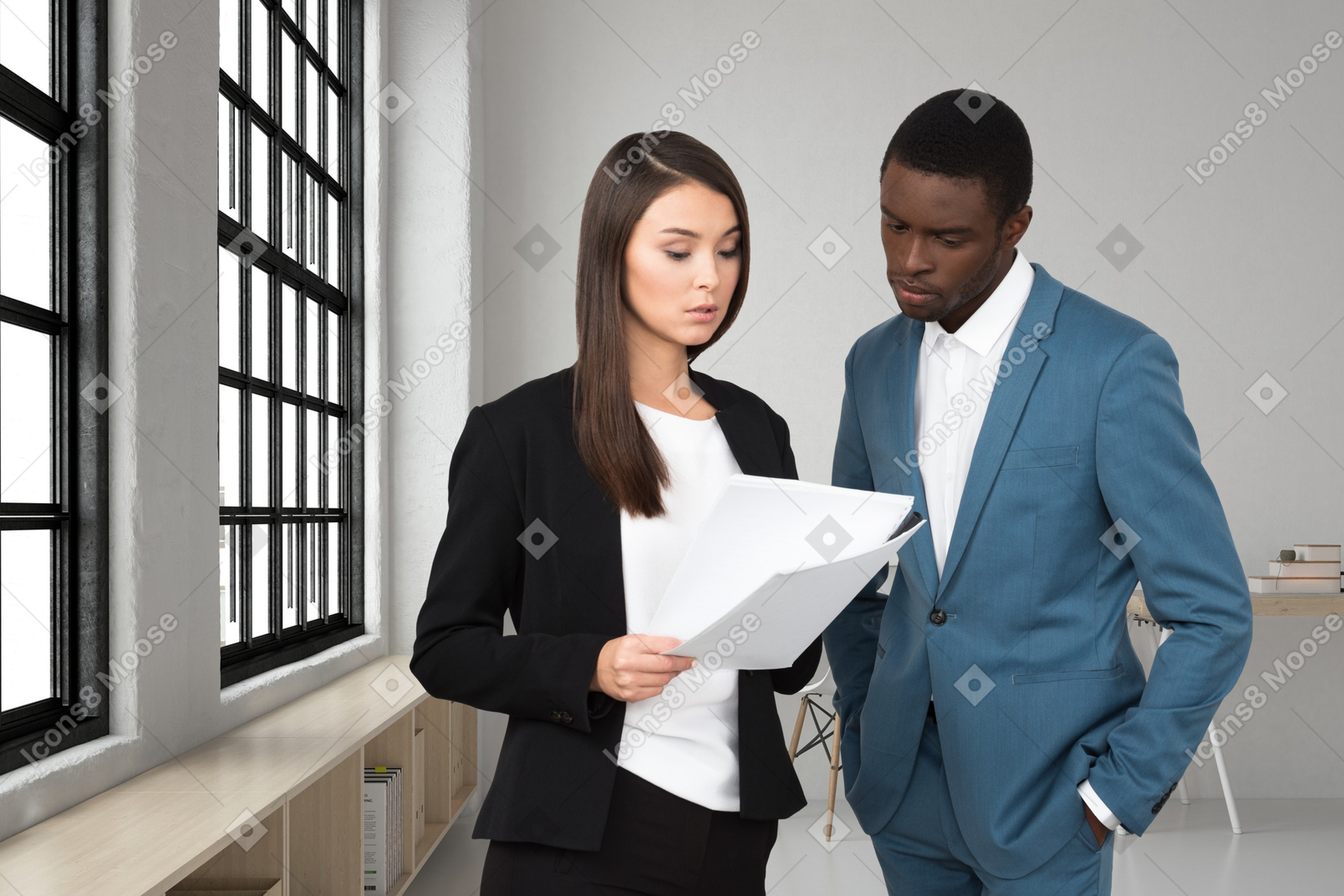 A man and a woman looking at a piece of paper