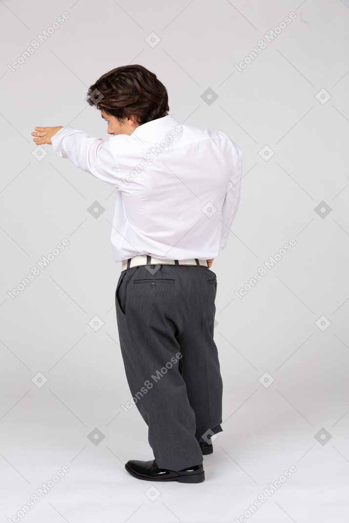 Young man outstretching arm