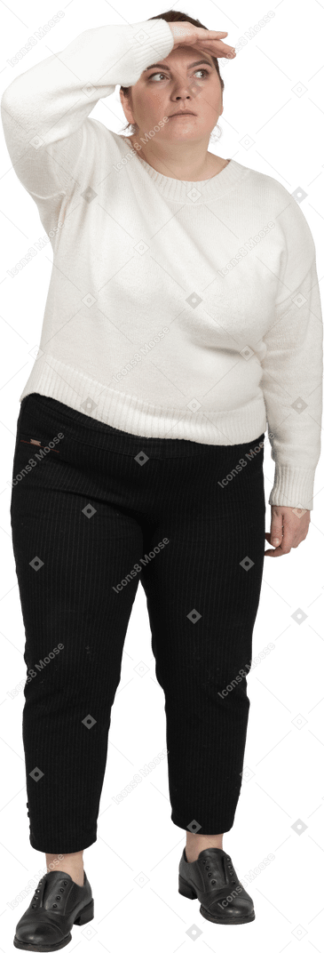 Plump woman in casual clothes looking for someone