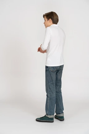 Young man in casual clothes standing