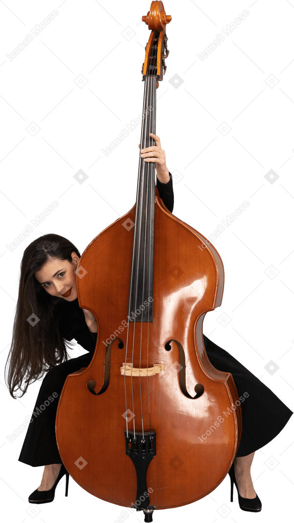 Front view of a crazy young lady squatting behind her double-bass