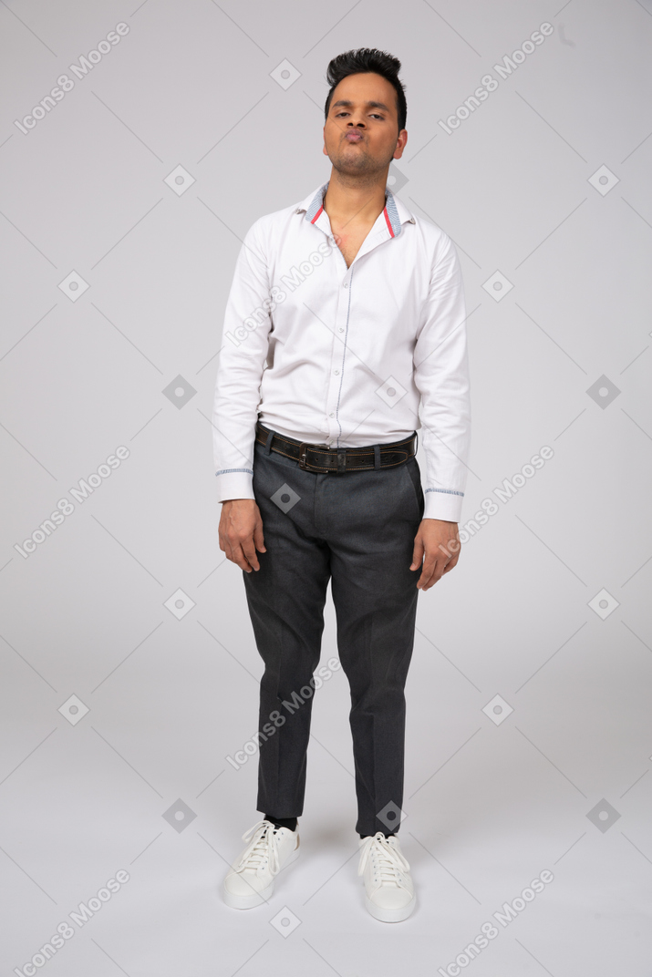 An arrogant man in a white shirt and black pants