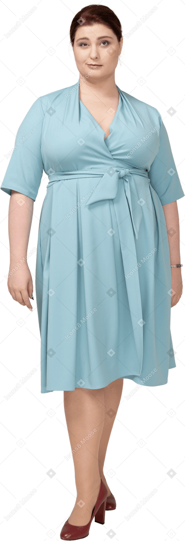 Front view of a woman in blue dress looking at camera