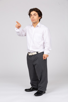 Young man pointing with index finger