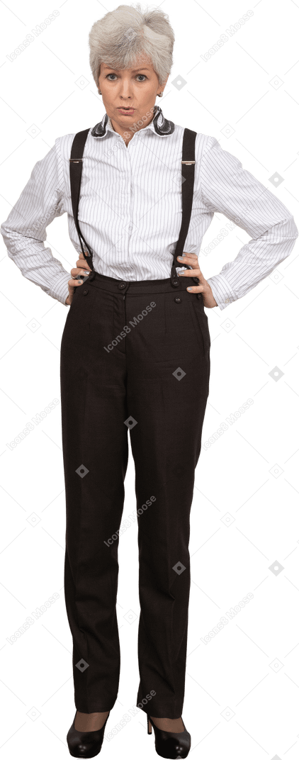 Front view of a displeased old lady in office clothing putting hands while looking at camera