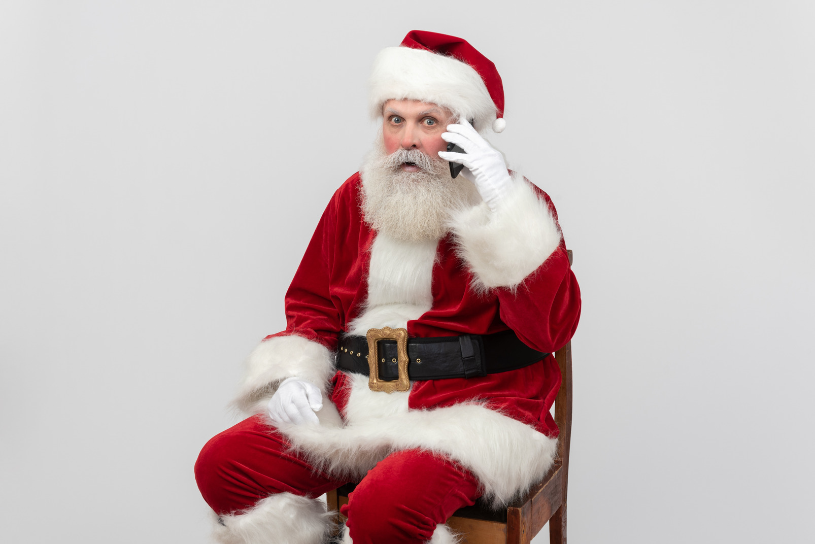 Santa claus seems to be surprised with conversation