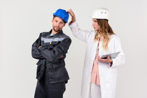 Female and male engineer colleagues discussing some work stuff