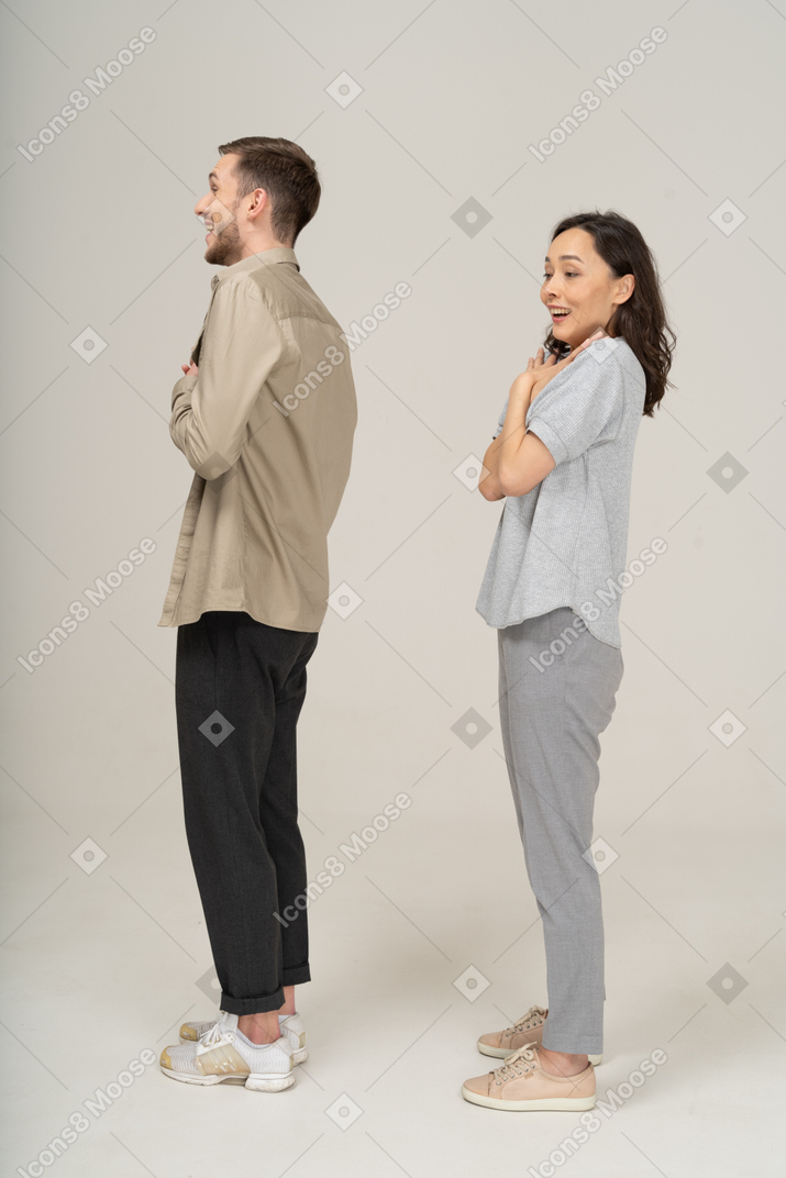 Side view of surprised young couple