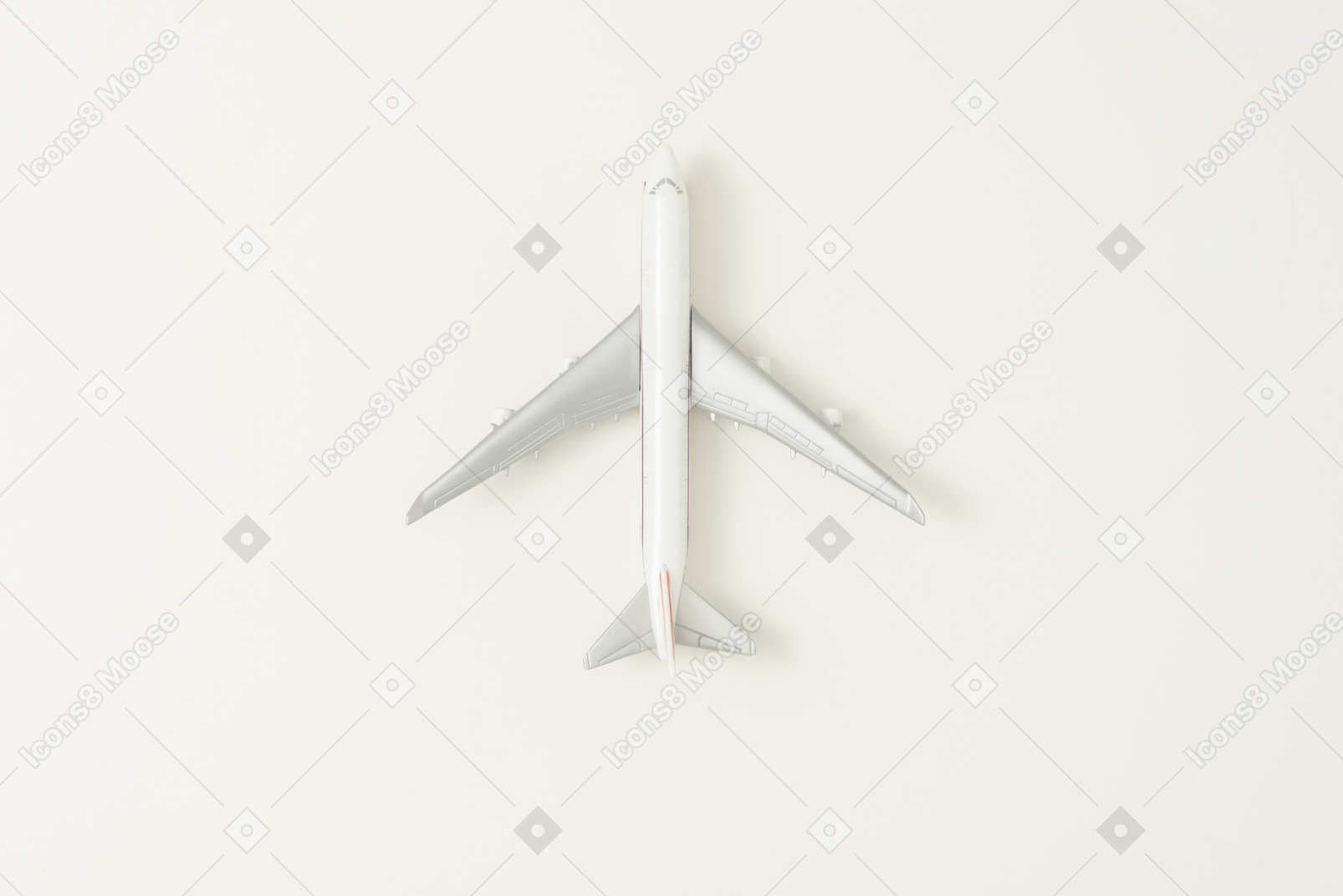 Toy airplane on grey background