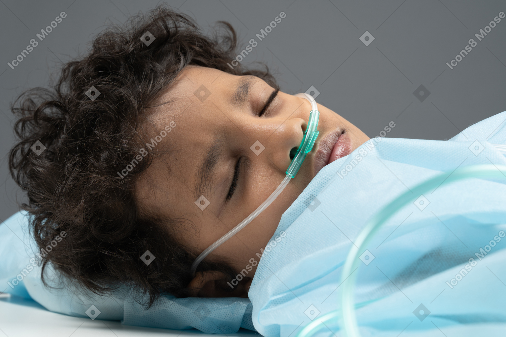 Child with nasal cannula closed his eyes