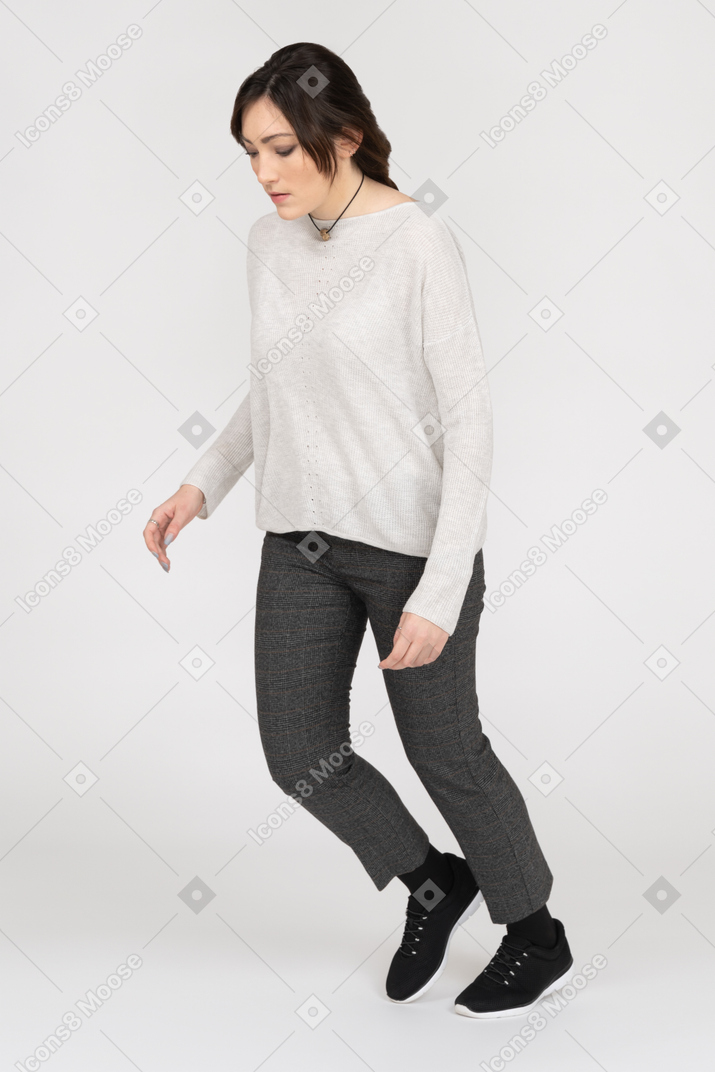 Woman bending forward experiencing gravity force